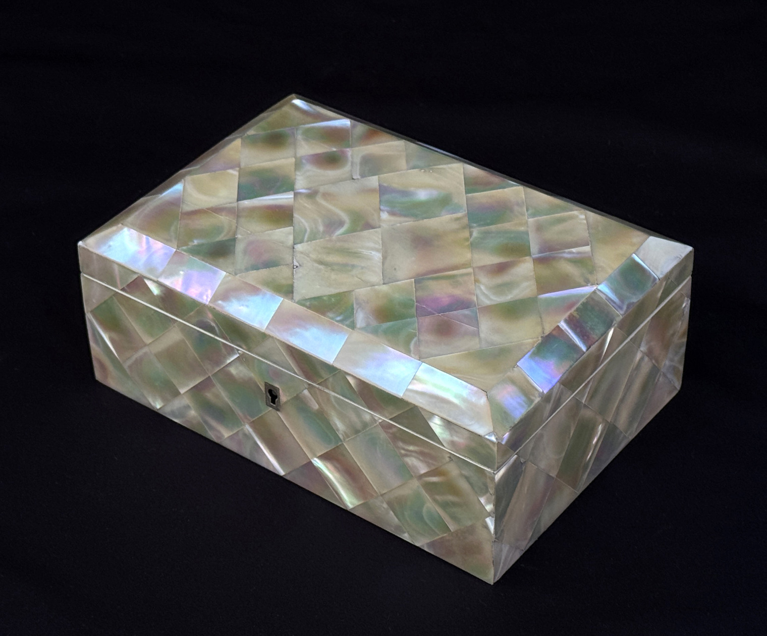 Front right view of an antique mother-of-pearl inlaid jewellery box.